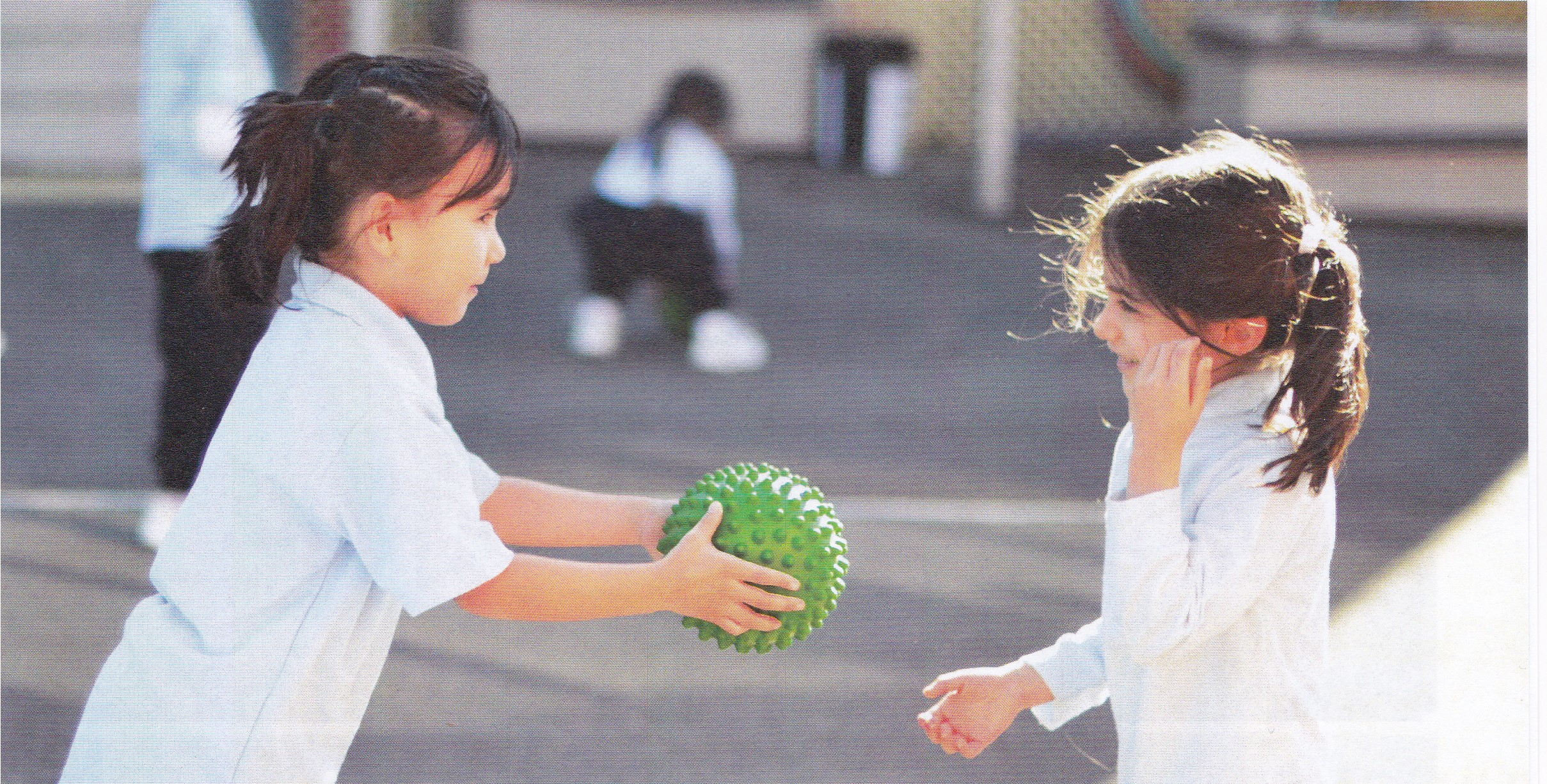 student sharing a ball with another student