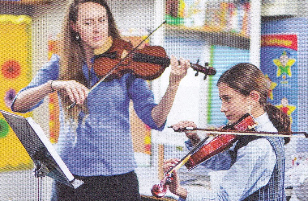 student learning the violin